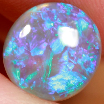 SOLID CRYSTAL OPAL Blue fire in a very 3 dimensional play of colour. Bright, clean colours. With VIDEO